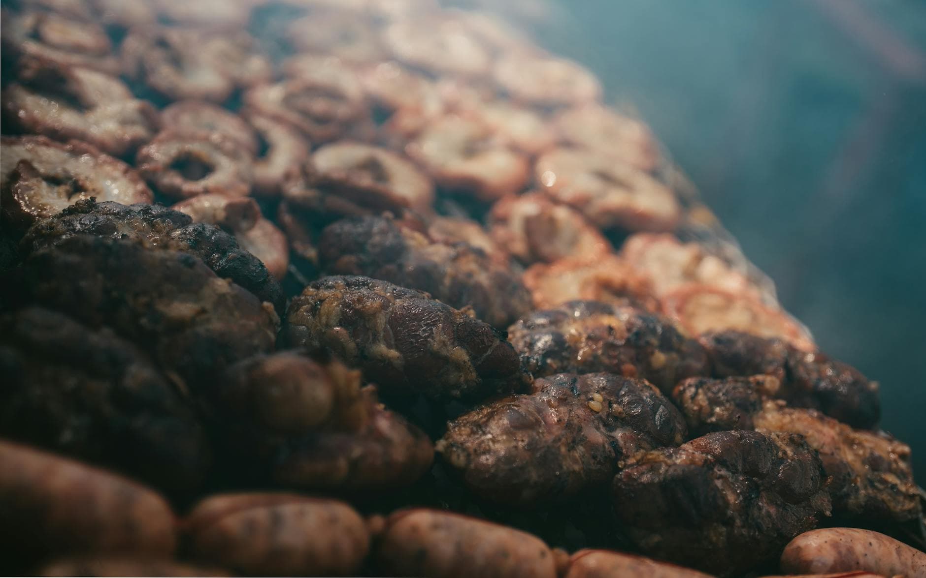 Close-up of traditional Argentine asado grilling with meats and sausages in Uribelarrea.