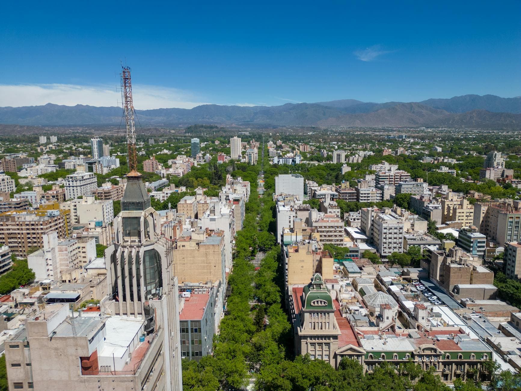 Aerial view of Mendoza cityscape with urban skyline and Andes Mountains in Argentina.