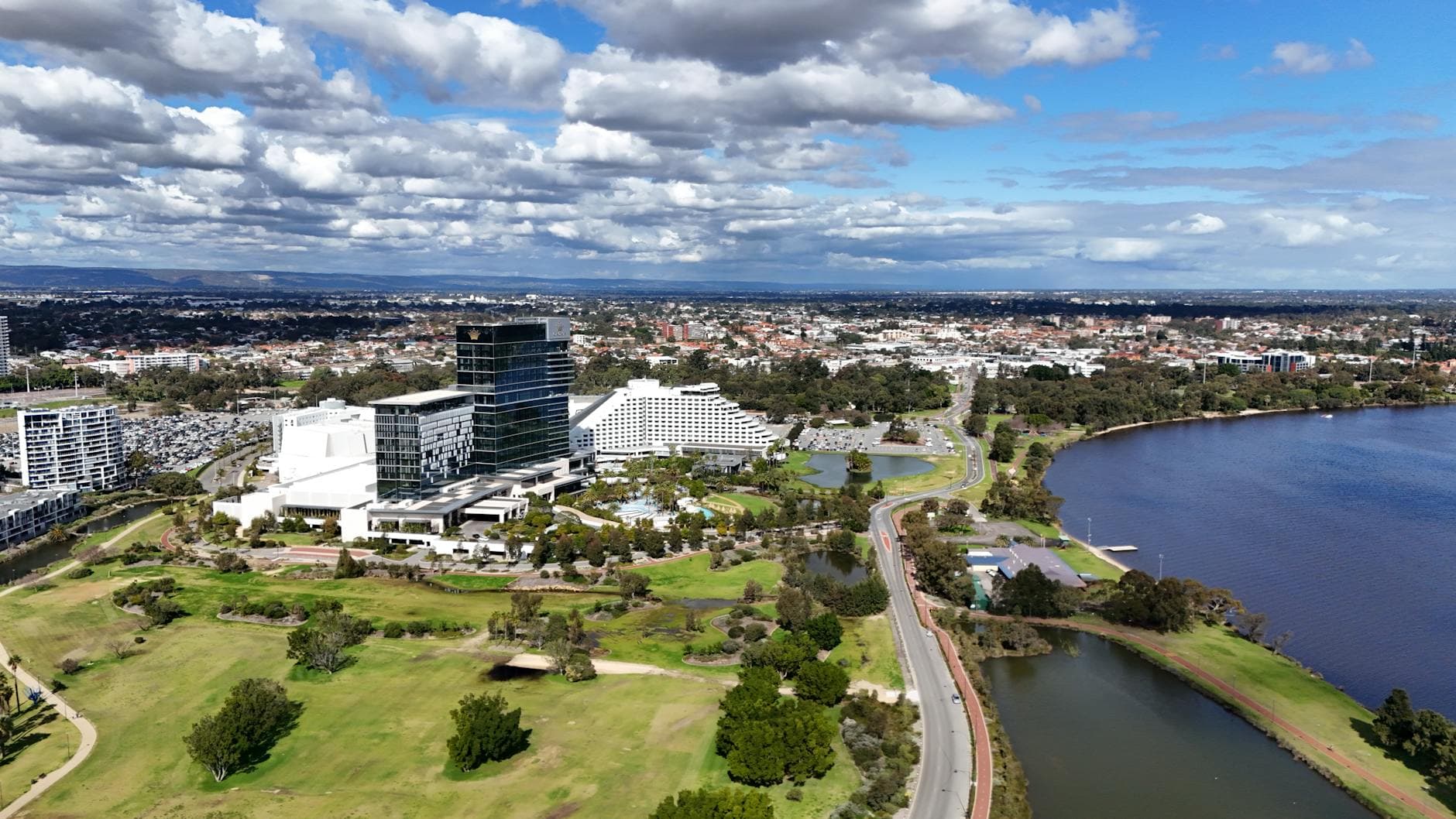 Aerial view capturing Burswood in WA, Australia featuring urban landscape and the scenic Swan River.