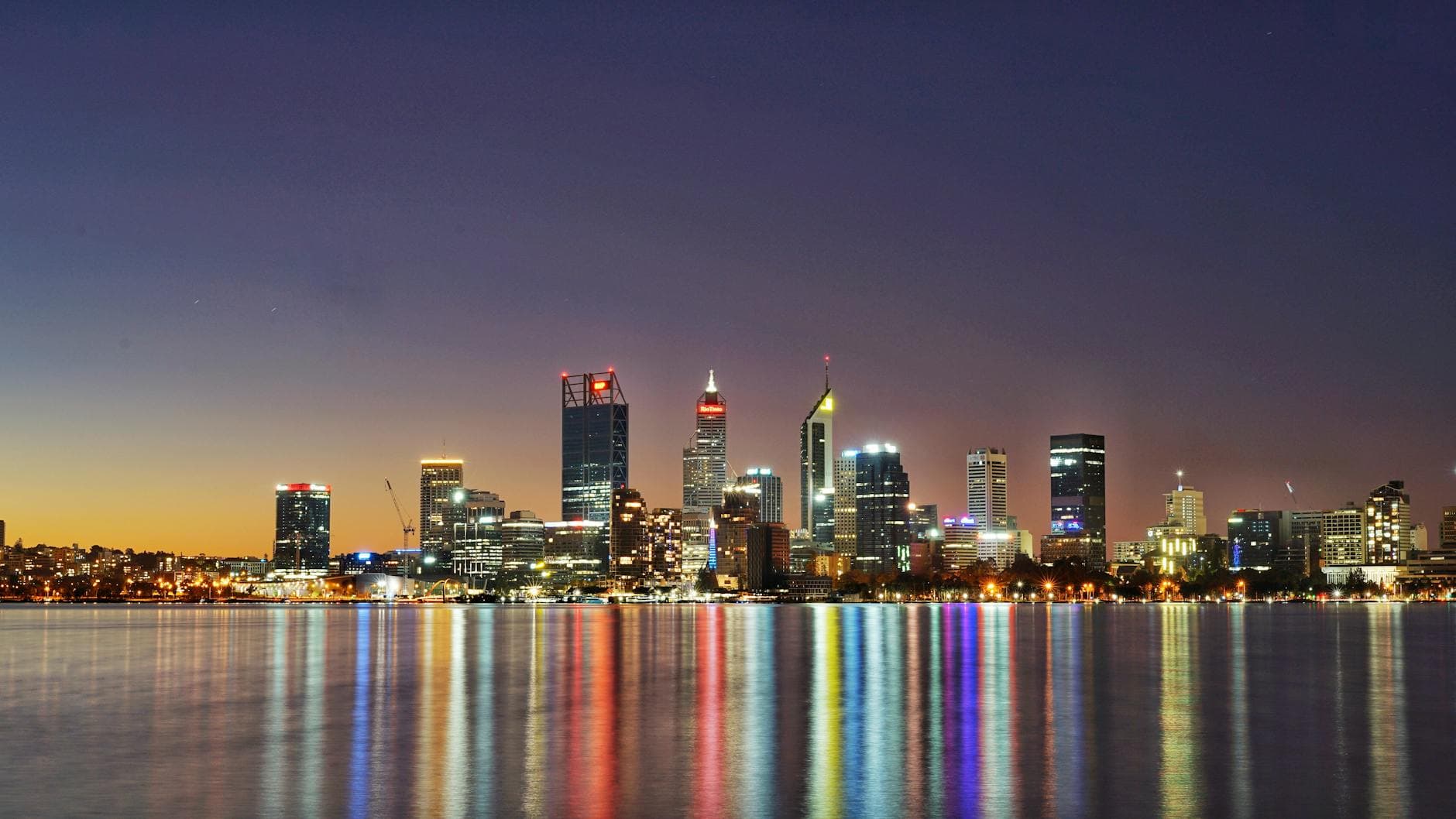Beautiful twilight view of Perth city skyline reflecting in the water.