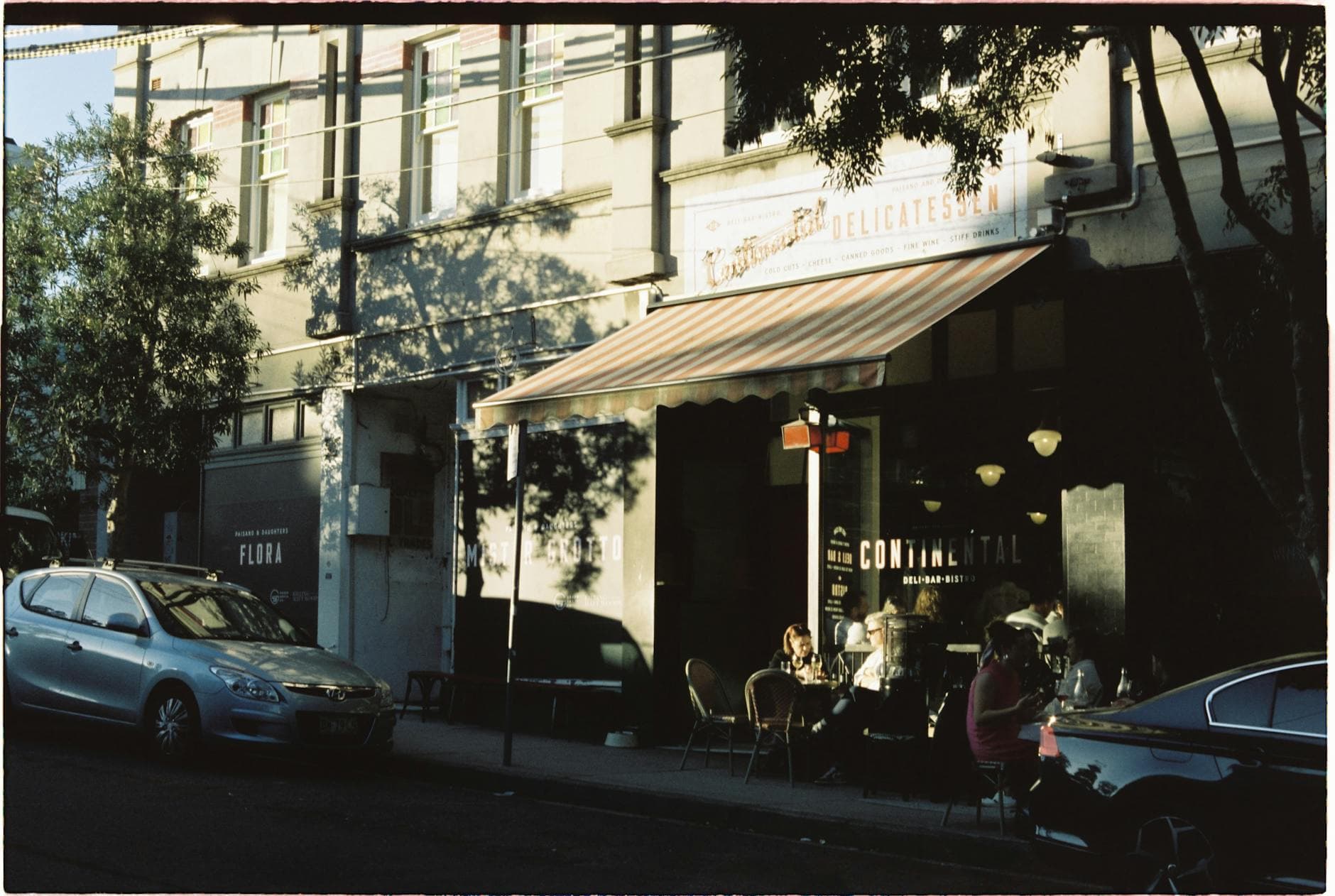 Cozy street cafe in Newtown, New South Wales during golden hour. Perfect urban lifestyle image.