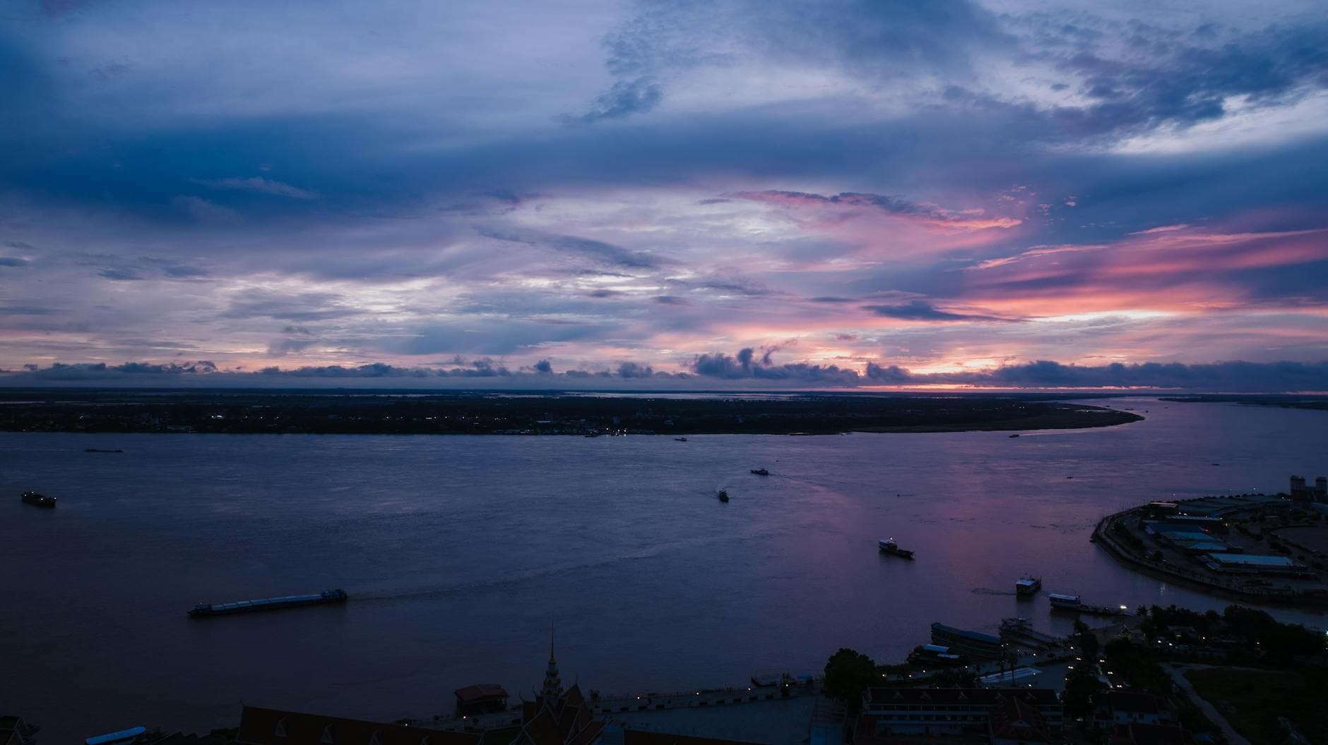 A breathtaking aerial view of sunset over the river in Phnom Penh, Cambodia.
