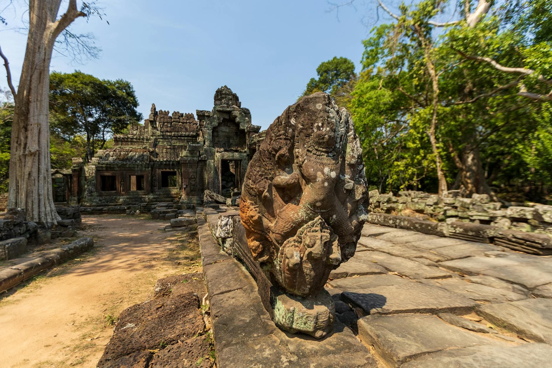 Explore the detailed stone sculptures at an ancient temple ruin in Siem Reap, Cambodia.