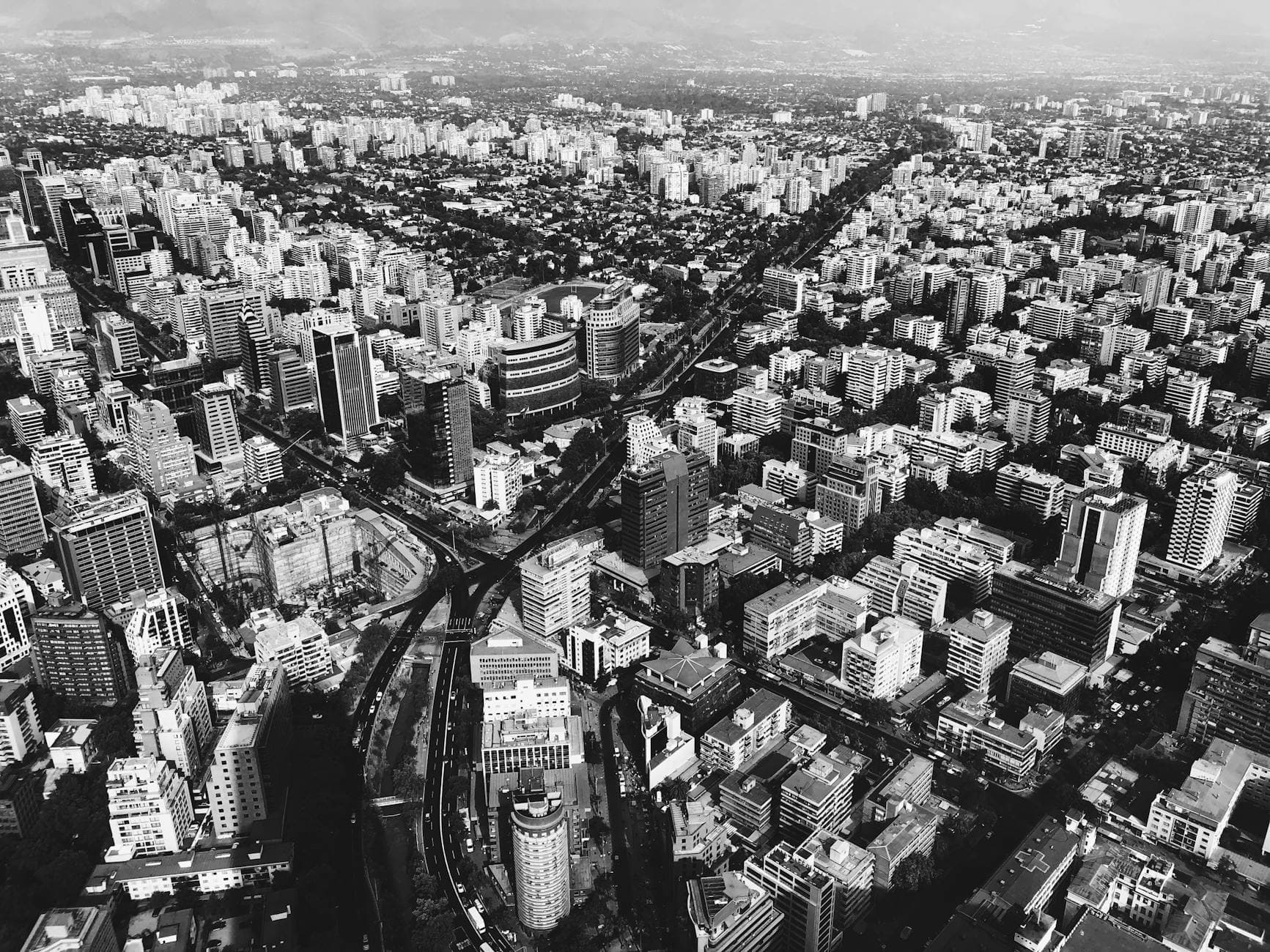 Aerial cityscape of Santiago, Chile, showcasing modern architecture and skyline.