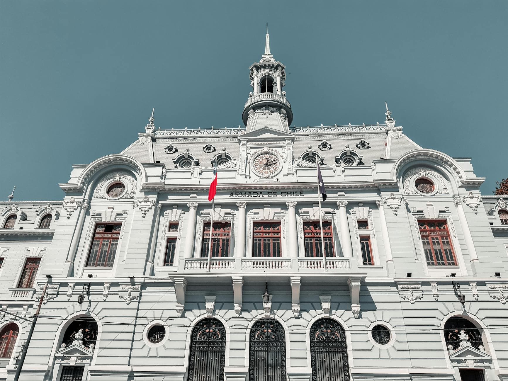 Majestic view of the Armada de Chile building in Valparaíso, Chile, with clear blue skies.