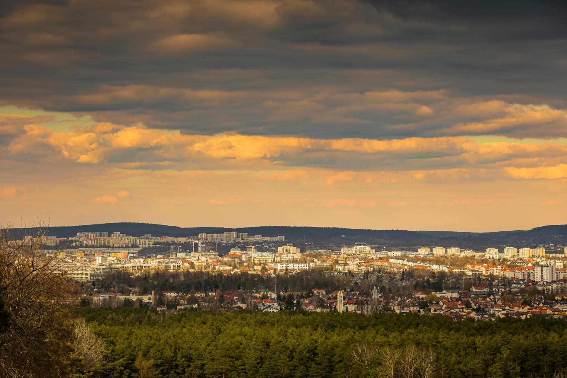 Captivating cityscape with dramatic clouds during the evening, capturing the essence of urban life.