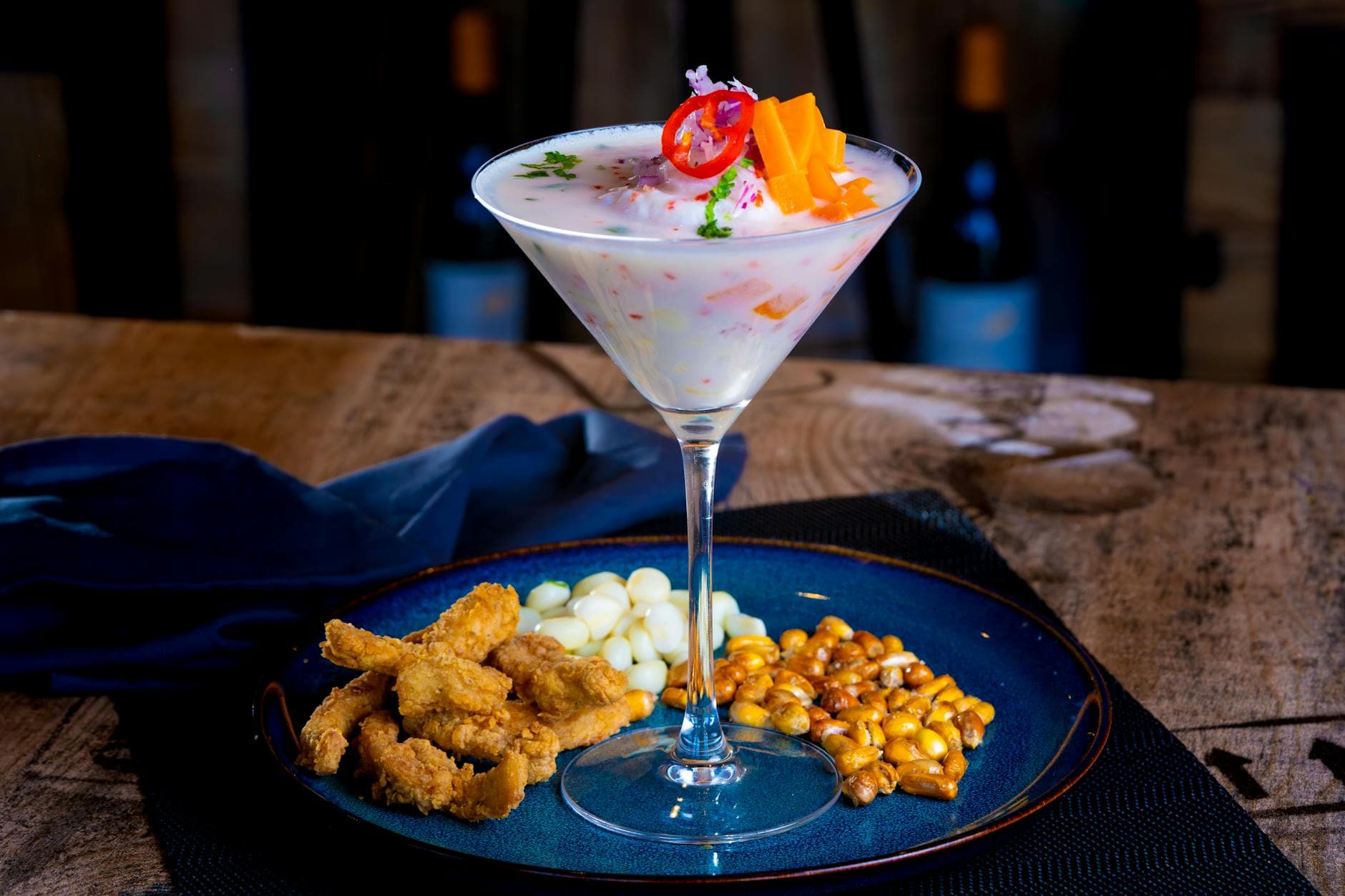 Vibrant Peruvian ceviche served with corn nuts and calamari.