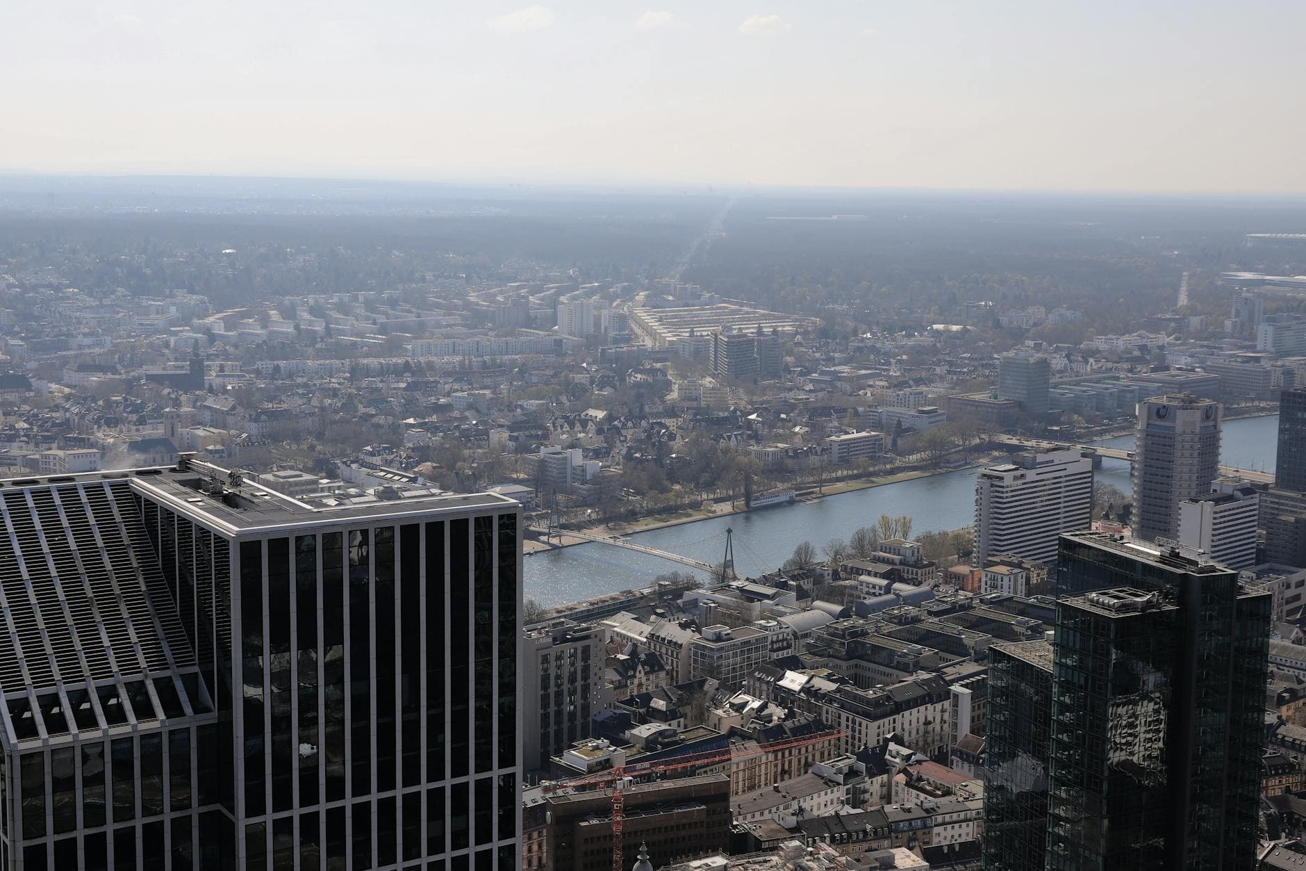 A stunning aerial view of Frankfurt, showcasing skyscrapers and the Main River.