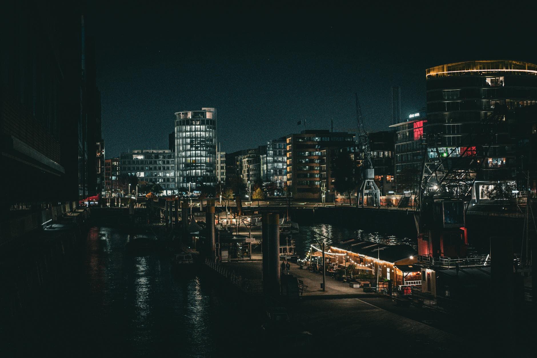 Captivating night view of Hamburg port showcasing city lights and architectural beauty.