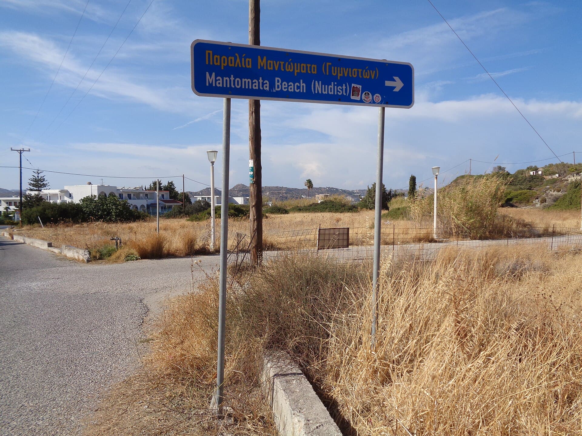 Fingerpost Mandomata Beach (Nudist) on the Roadside in Faliraki Rhodes 1 September 2024