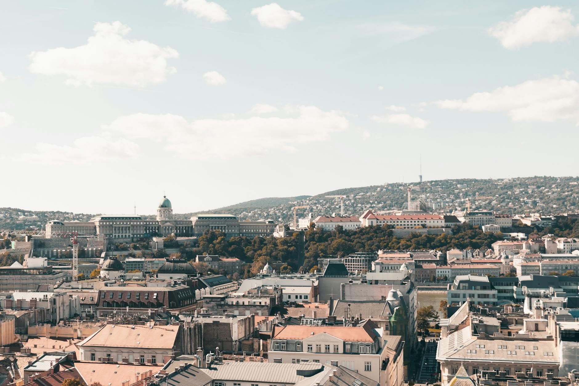 Expansive view of Budapest architecture with historic landmarks in clear daylight.