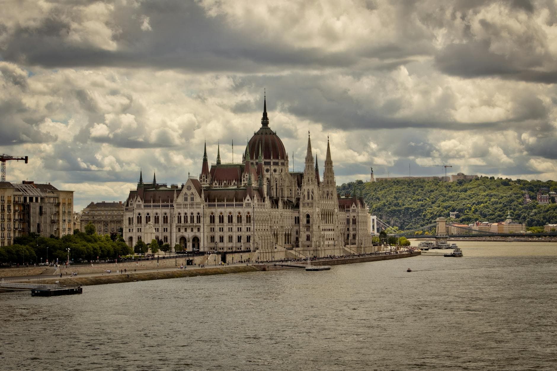 Scenic view of the Hungarian Parliament Building on a cloudy day in Budapest.