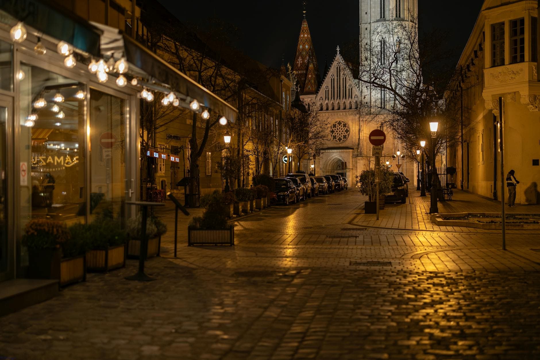 Charming night shot of Budapest's historic Matthias Church and surrounding area.