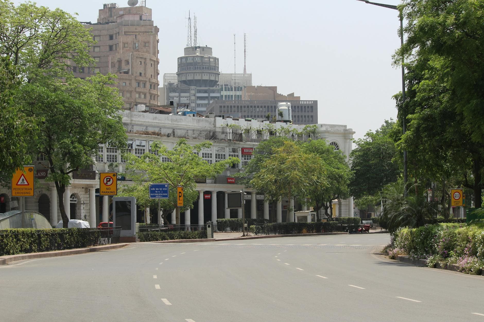 A serene view of Connaught Place with empty streets and iconic buildings in the background.