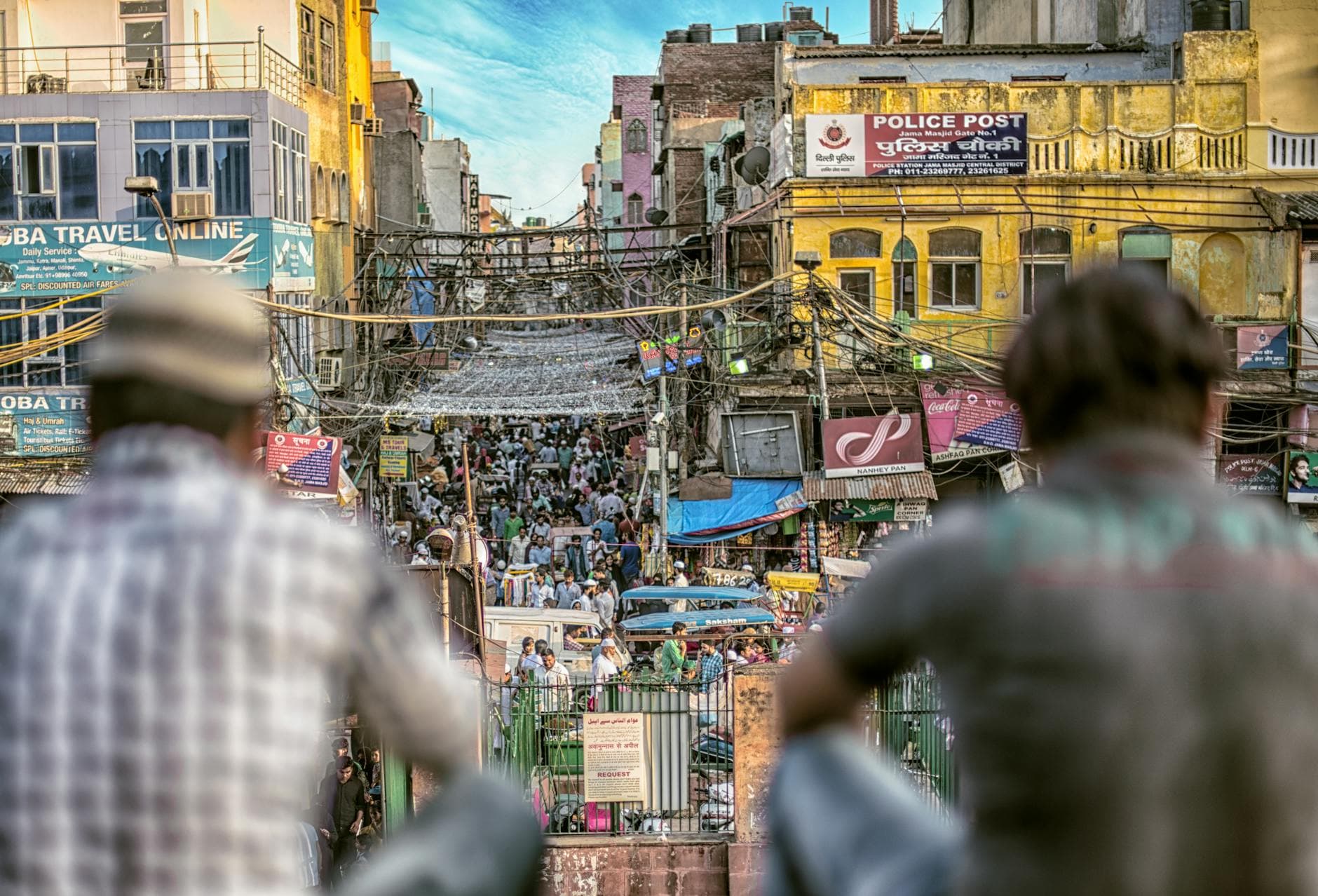 A bustling street market in Old Delhi, India, showcasing urban life and commerce.