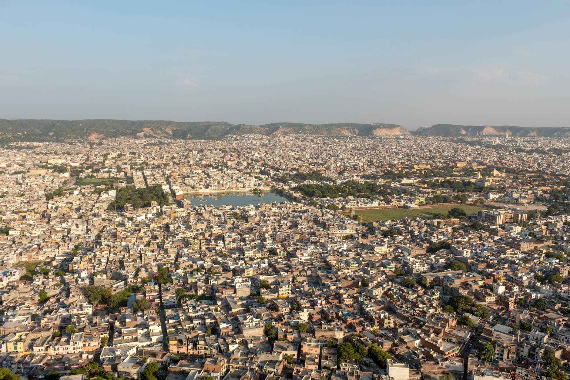 Panoramic aerial view of Jaipur, showcasing urban landscape and architectural heritage.