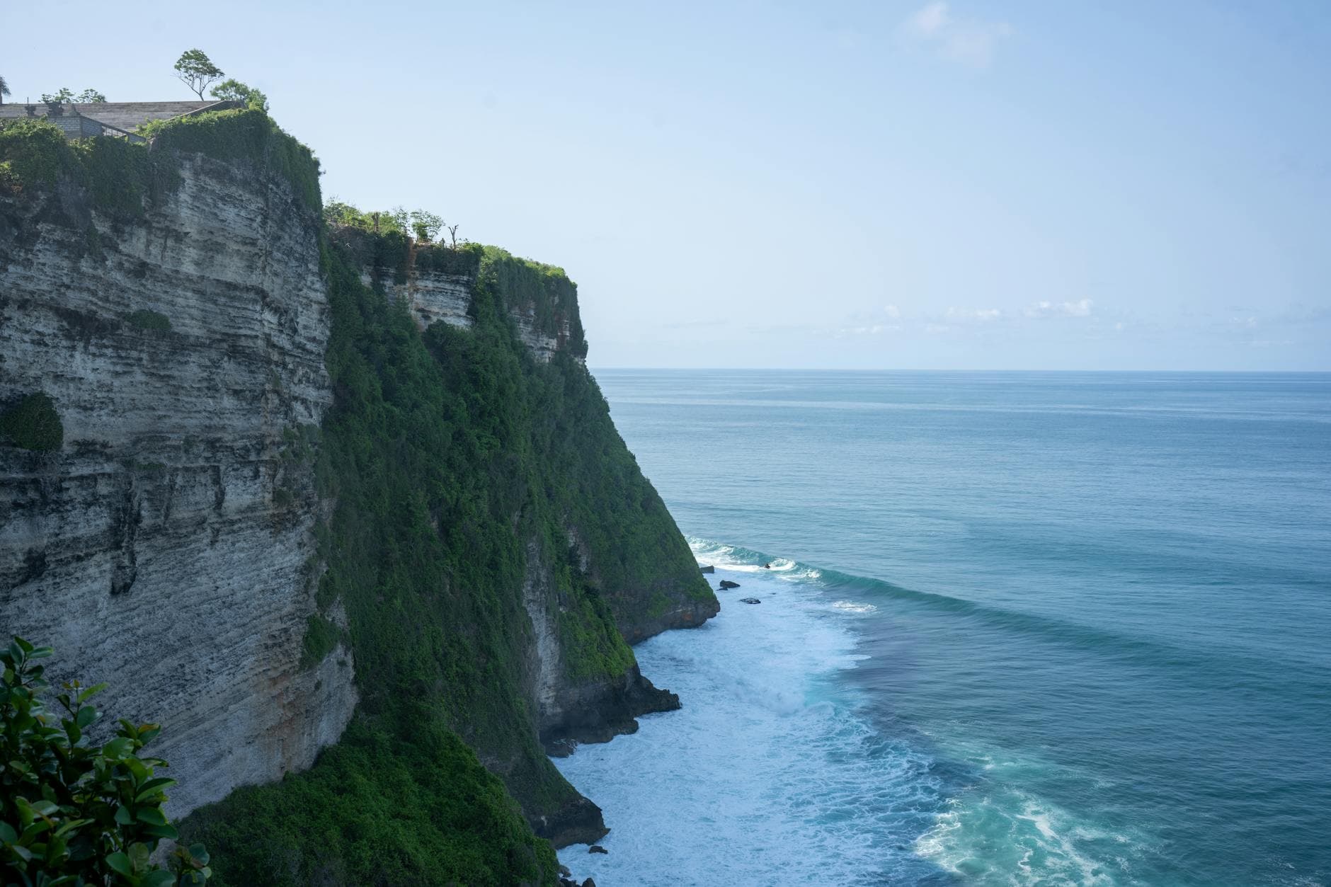 Breathtaking view of Uluwatu Cliffs meeting the Indian Ocean in Bali, Indonesia.