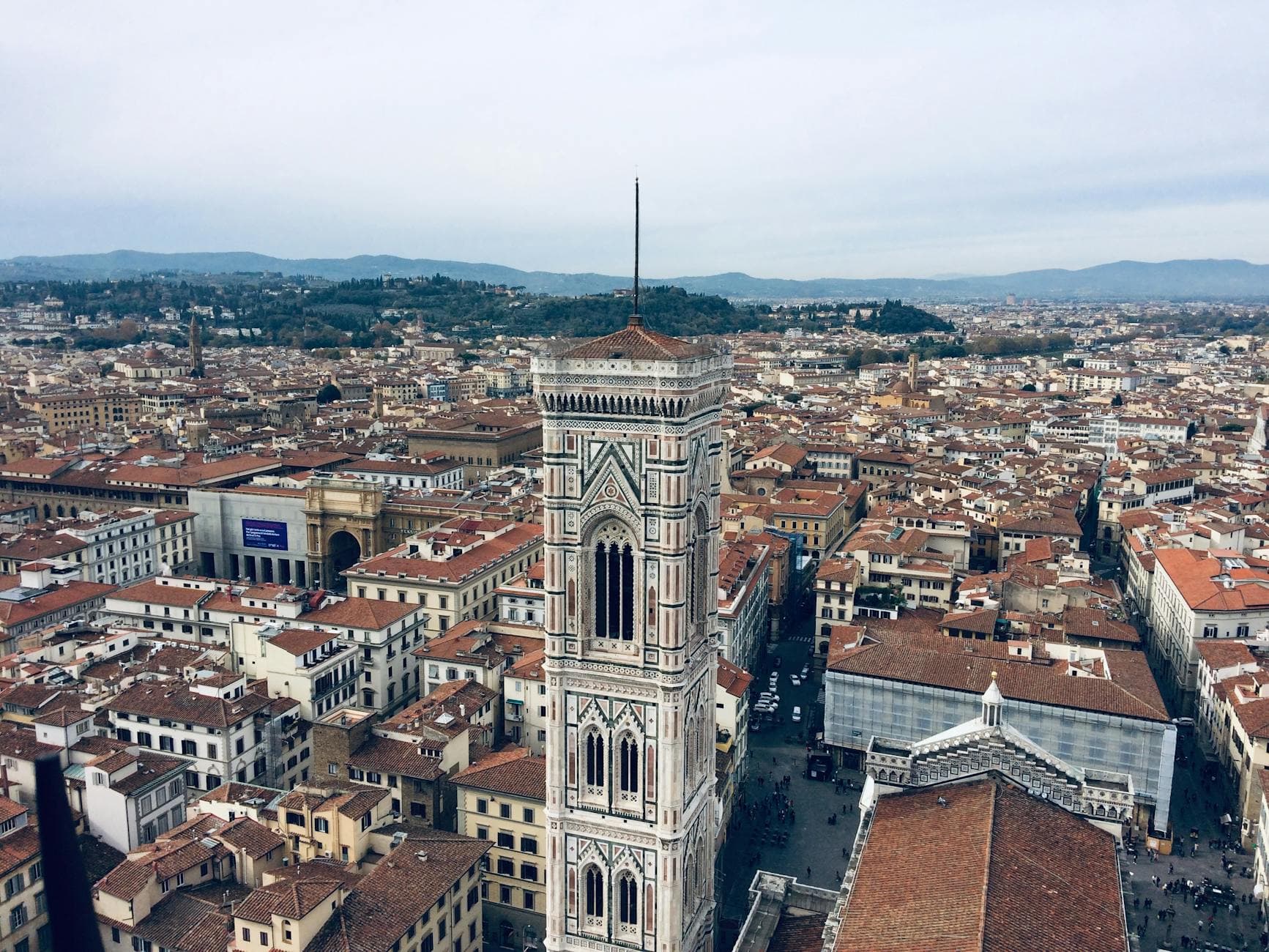 Aerial photo of Florence, Italy highlighting Giotto's Campanile and historic architecture.