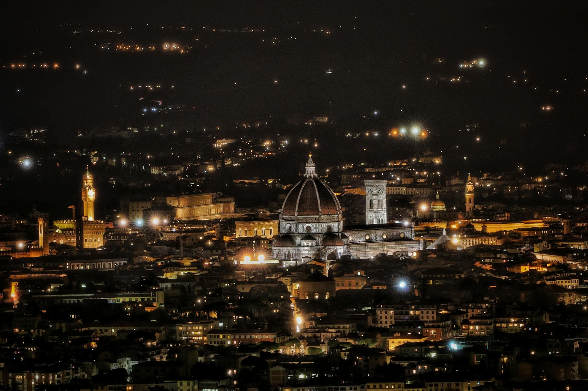 Majestic scenery of illuminated ancient city of Florence with famous Santa Maria del Fiore cathedral at night