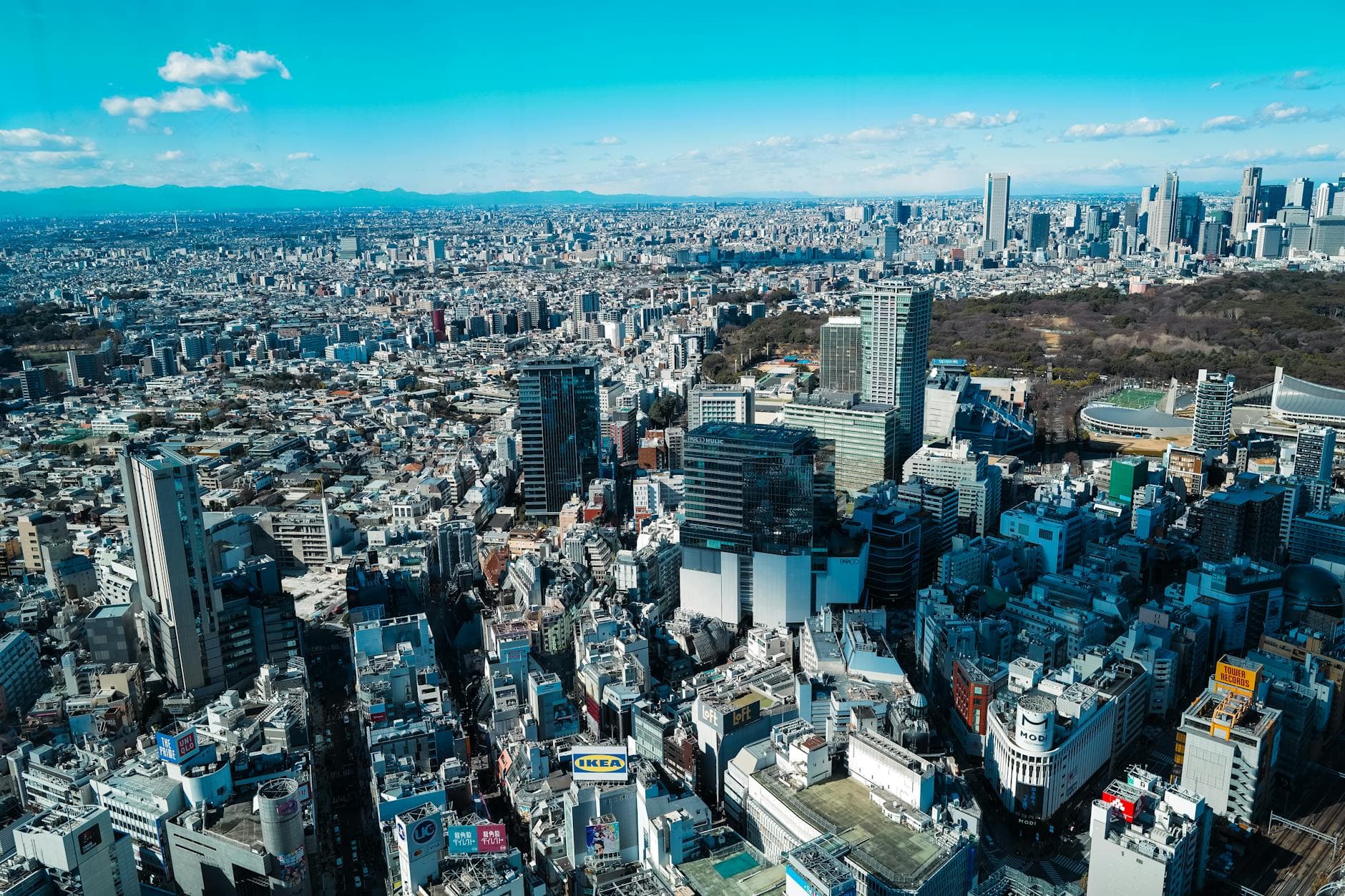 A stunning aerial shot of Tokyo showcasing its sprawling urban skyline and famous landmarks.