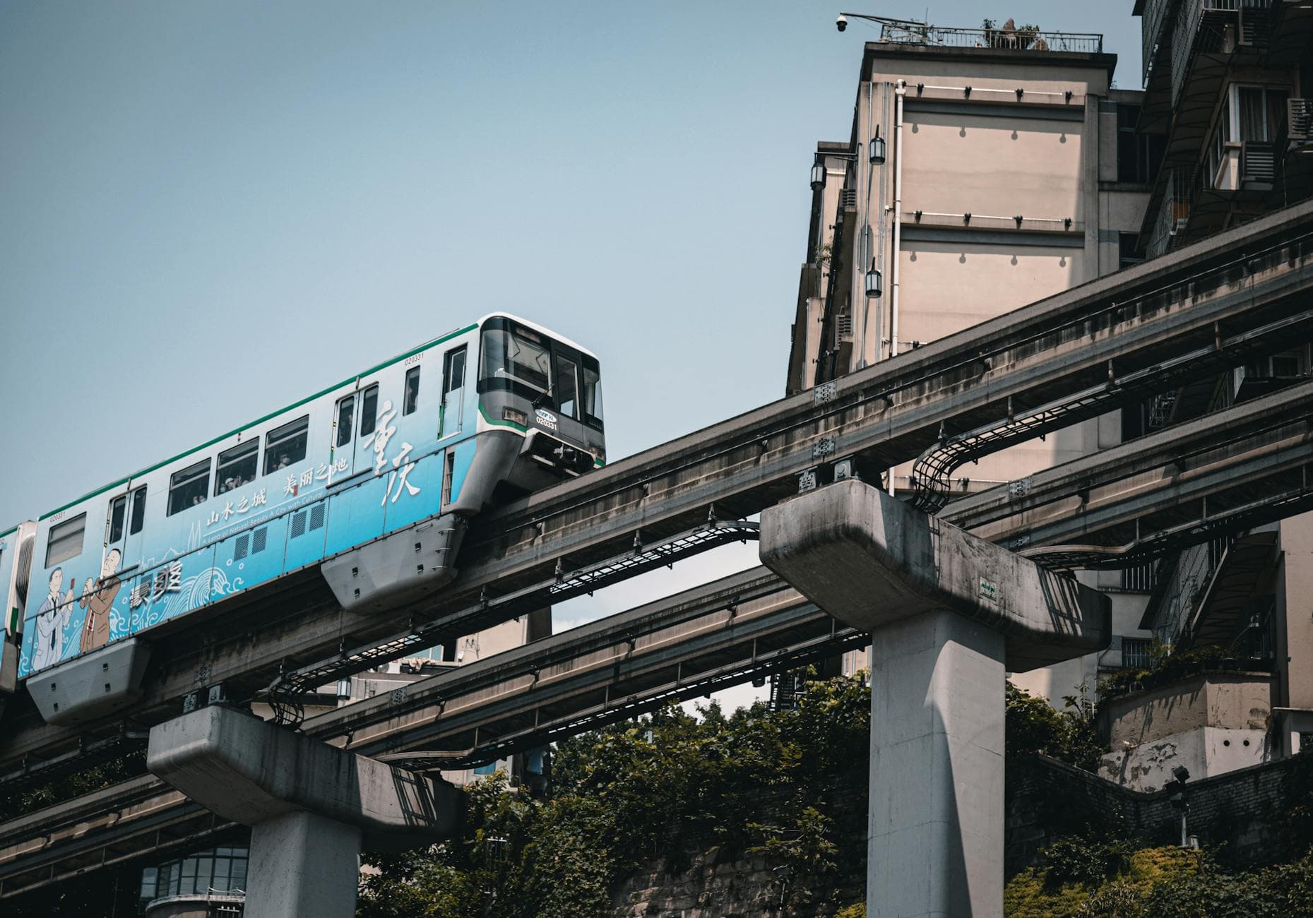 Chongqing's iconic monorail traversing urban architecture, capturing dynamic urban transport.