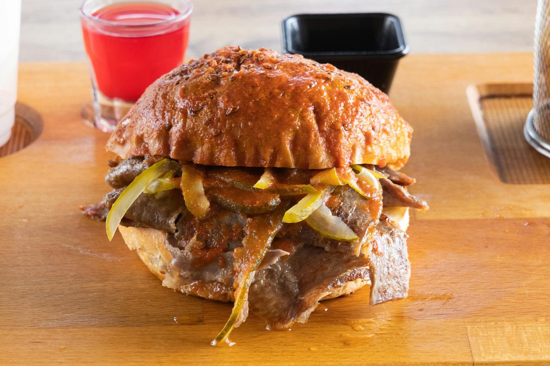 Delicious torta ahogada topped with meat and vegetables, perfect for fast food lovers.