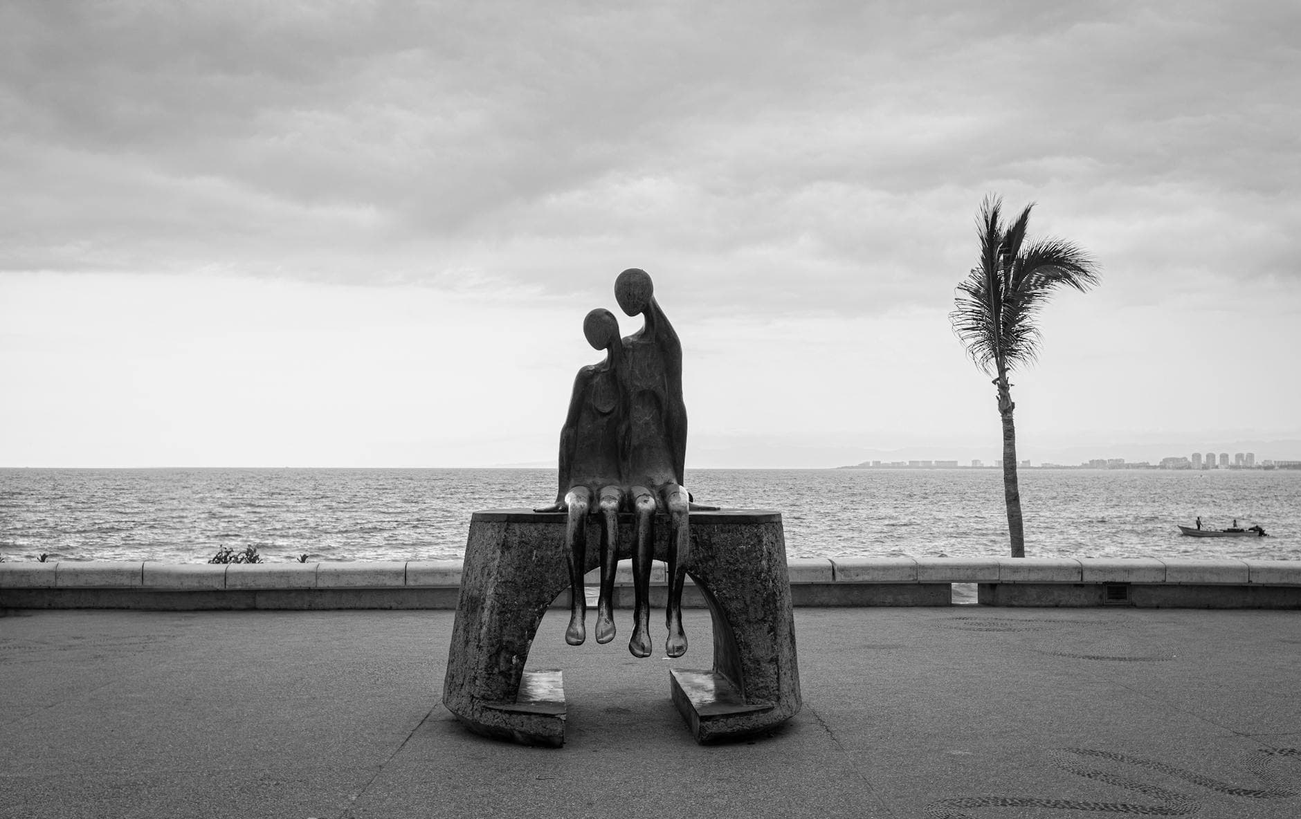 Dramatic black and white shot of famous sculpture on Puerto Vallarta Malecón, Mexico.