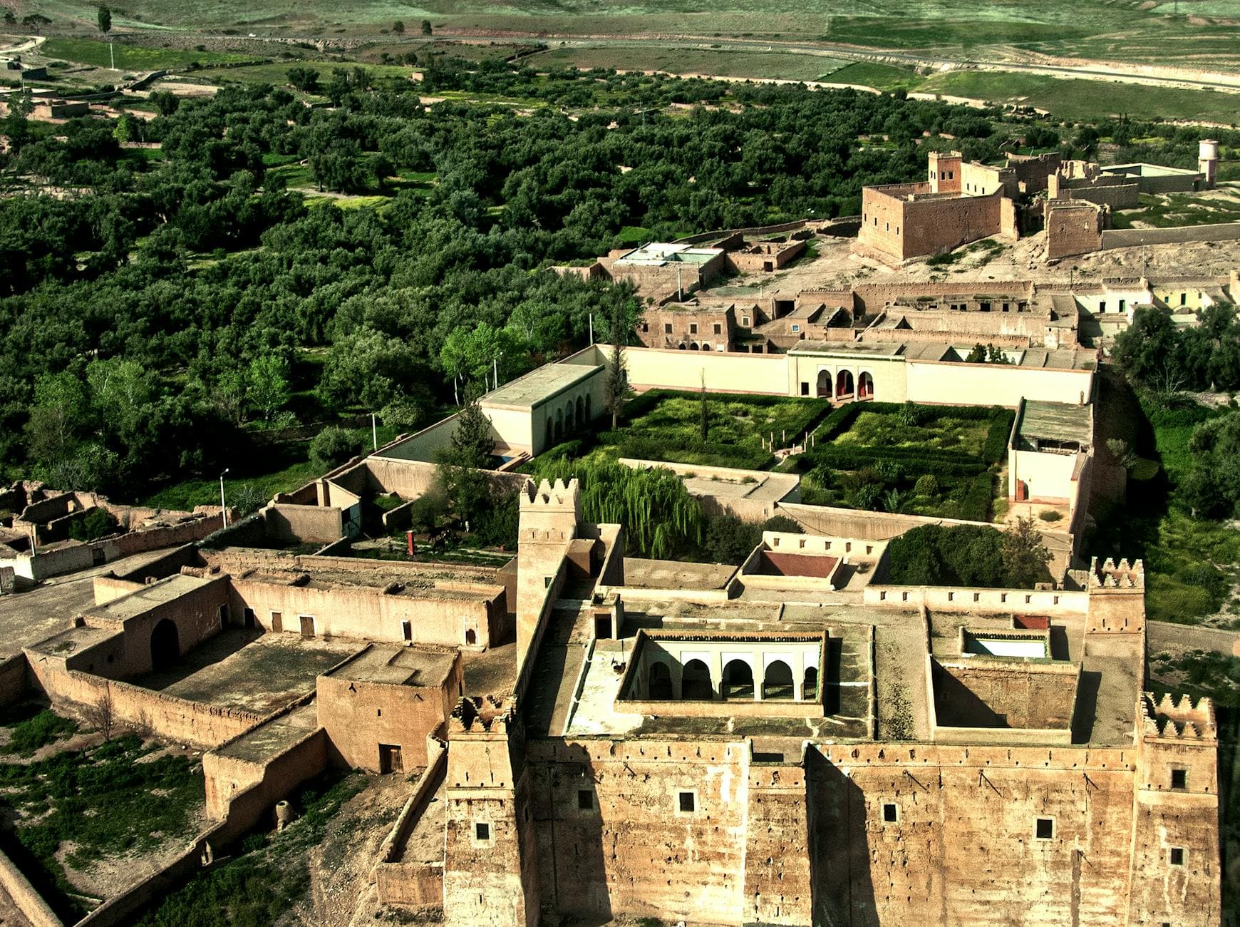 Explore the stunning bird's-eye view of Marrakech's historical architecture and lush landscapes.