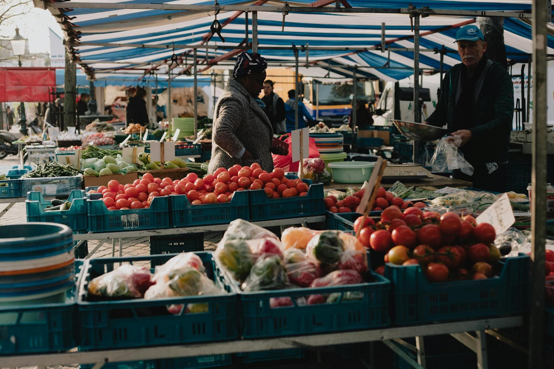 Explore the lively street market in Maastricht, Netherlands, showcasing fresh produce and local vendors.