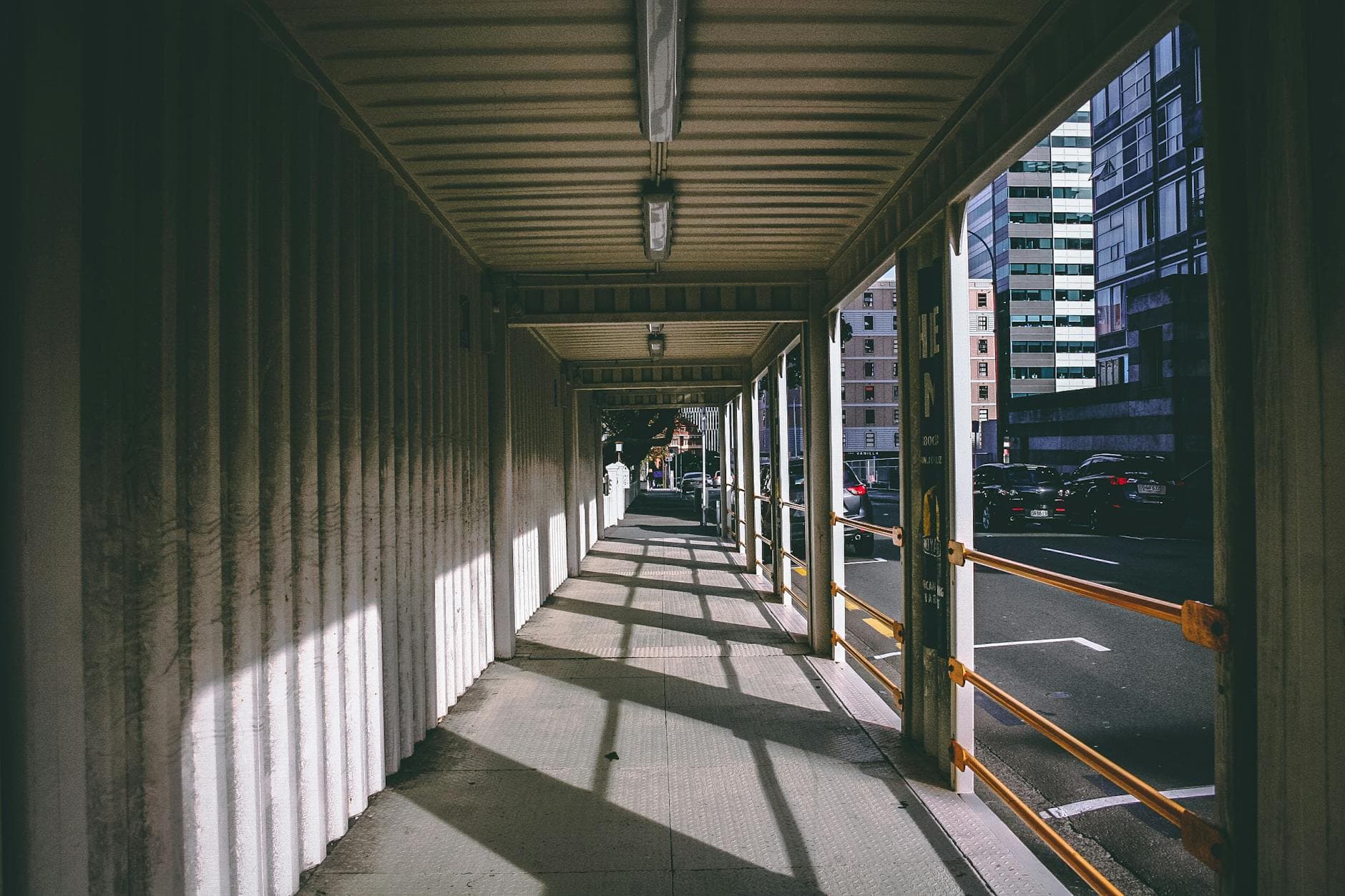 A sunlit corridor in Wellington, New Zealand showcasing urban architecture.