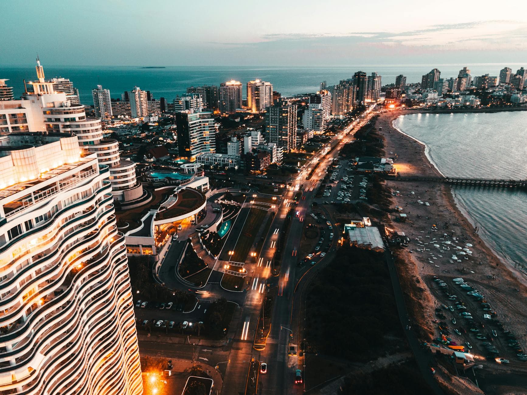 A breathtaking aerial shot of Punta del Este showcasing the waterfront and vibrant cityscape at twilight.