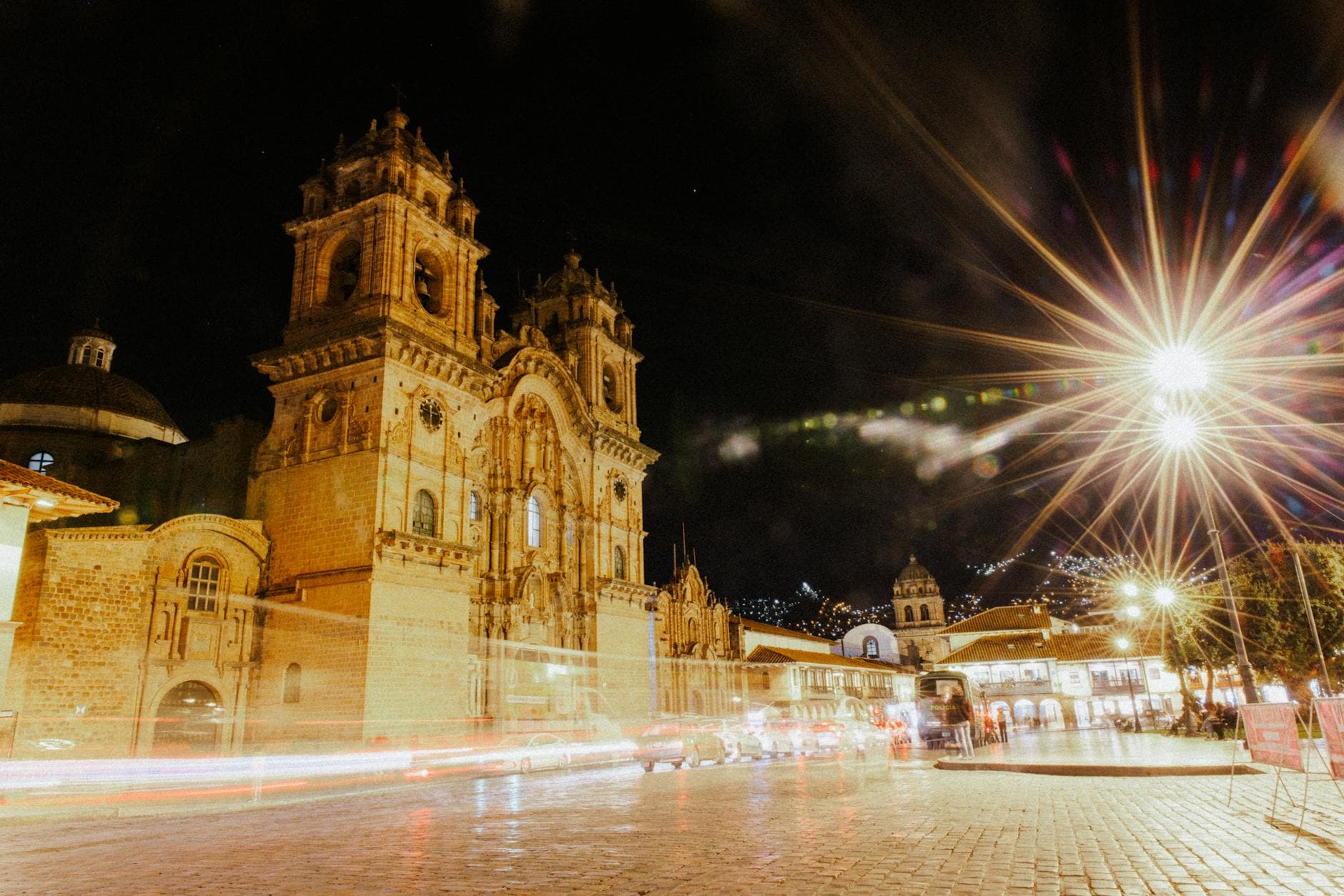 Long exposure night shot of Cusco Cathedral, Peru, capturing the illuminated streets and vibrant atmosphere.