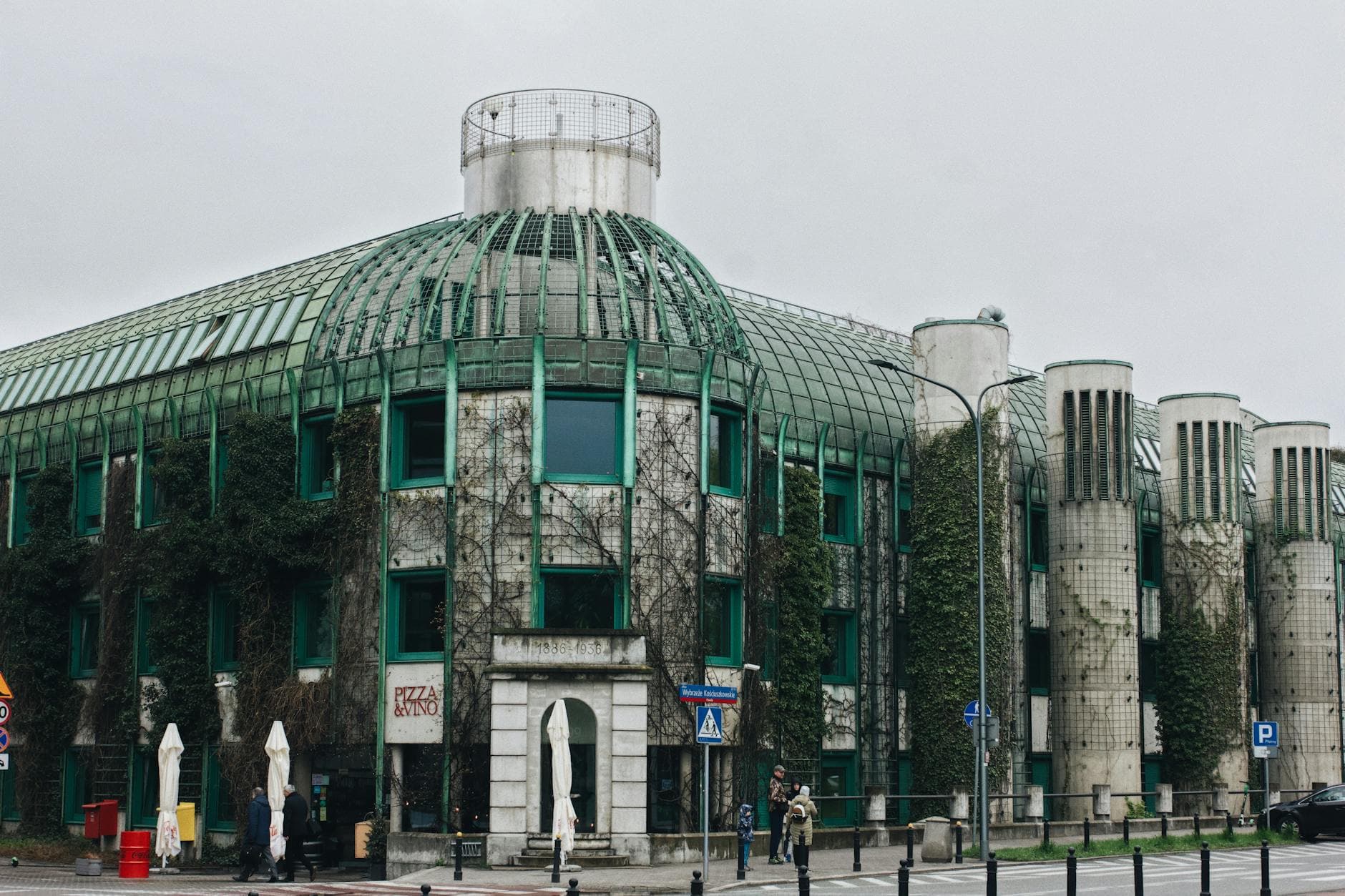 Ivy-covered Warsaw University Library showcasing modern eco-friendly architecture.