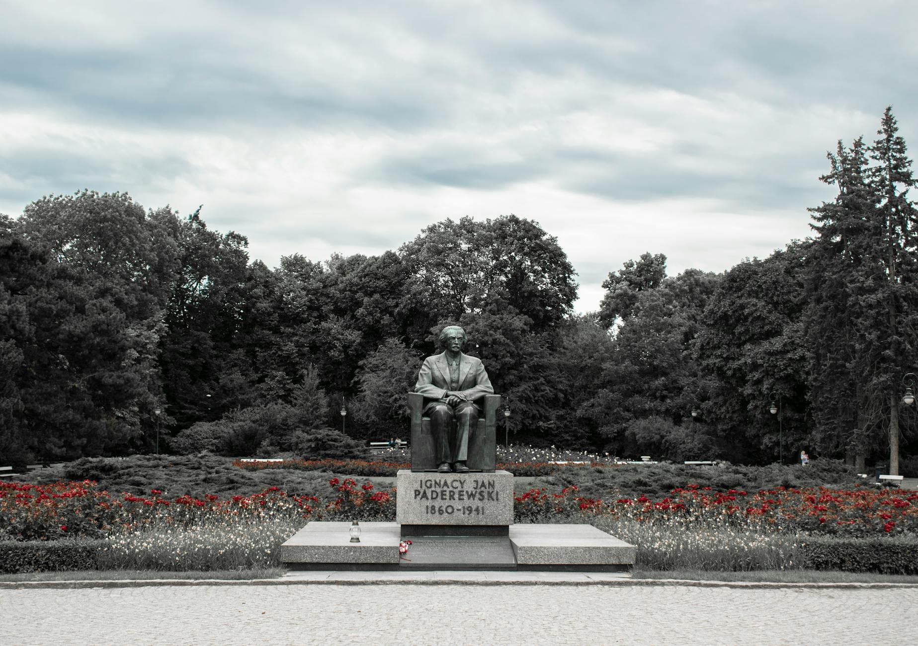 Monument of Ignacy Jan Paderewski surrounded by trees in Warsaw park, Poland.