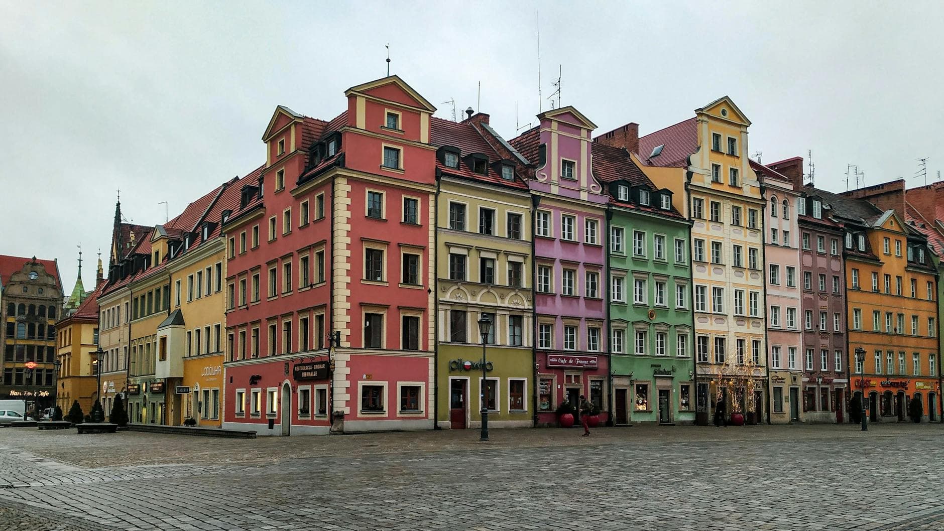 Vibrant tenement houses in Wrocław's town square, showcasing architectural charm in Poland.