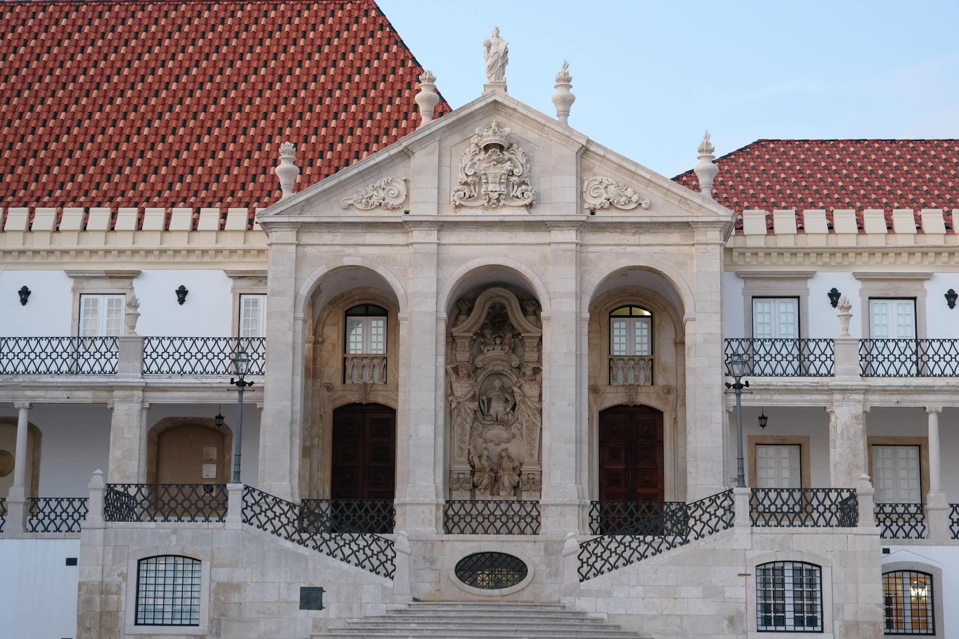 Front view of University of Coimbra's notable facade showcasing gothic architecture.