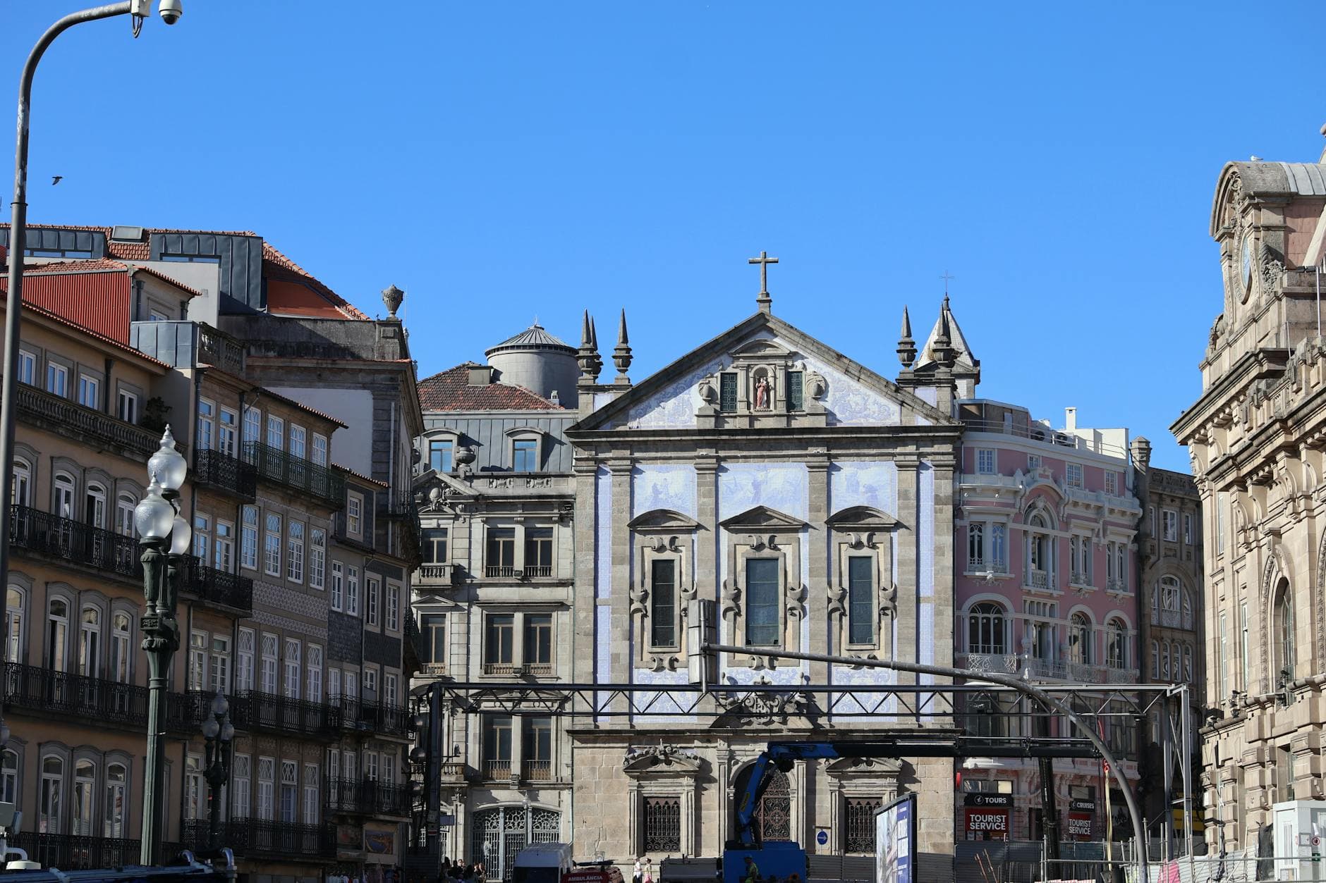 Scenic view of Porto's historic buildings with clear blue sky.