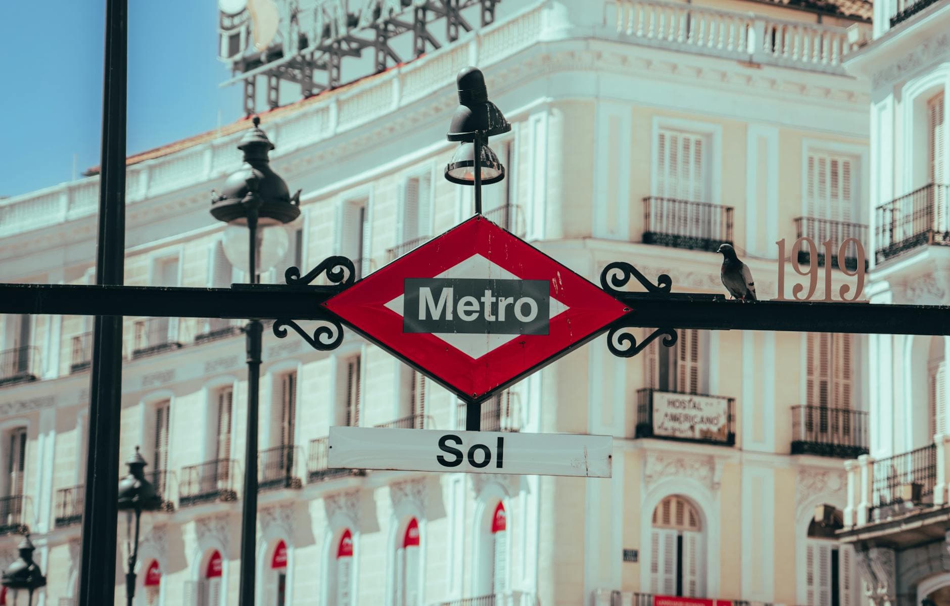 Iconic Sol metro sign located in the bustling heart of Madrid, symbolizing city transport.