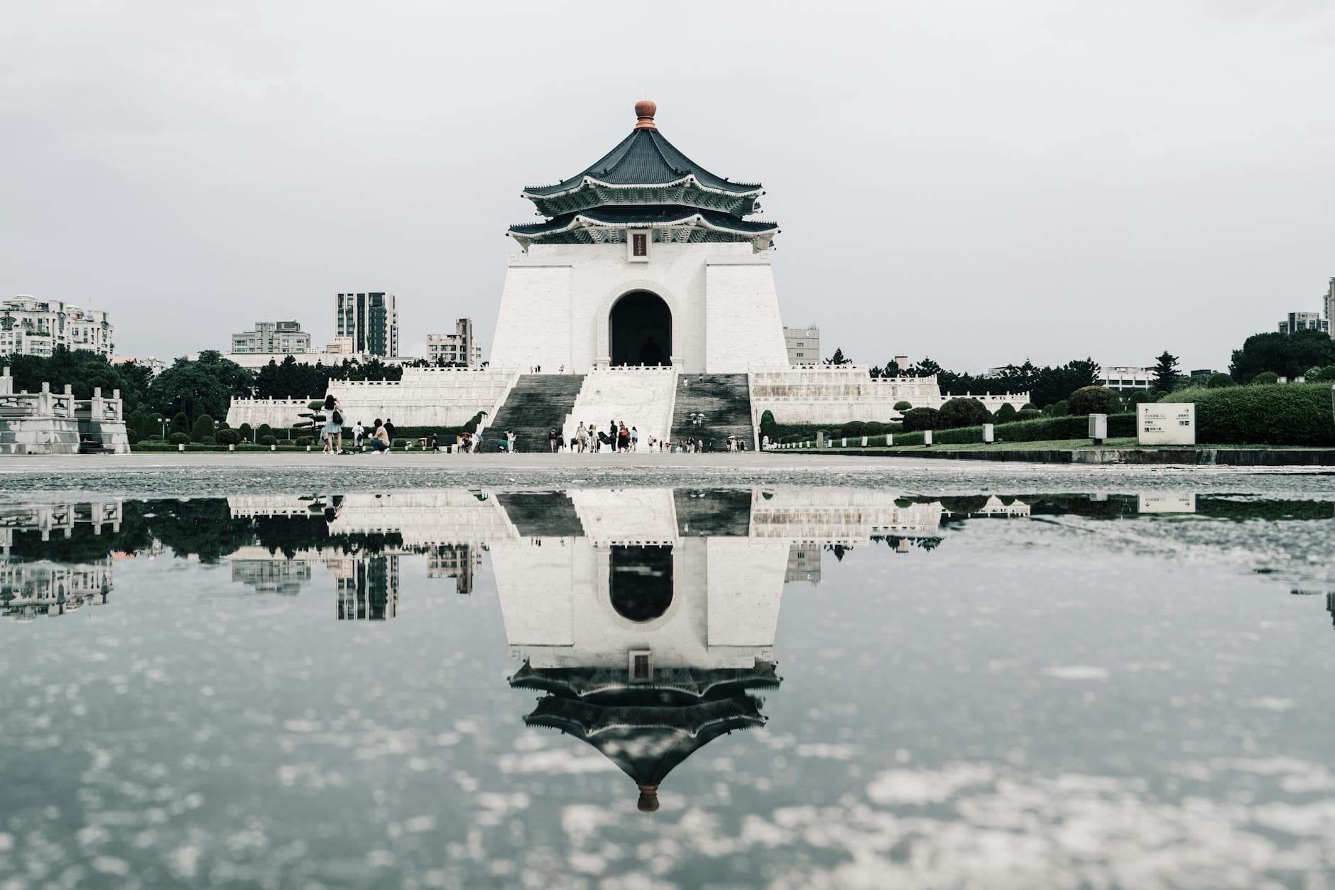 Stunning reflection of Chiang Kai-Shek Memorial in a puddle in Taipei.