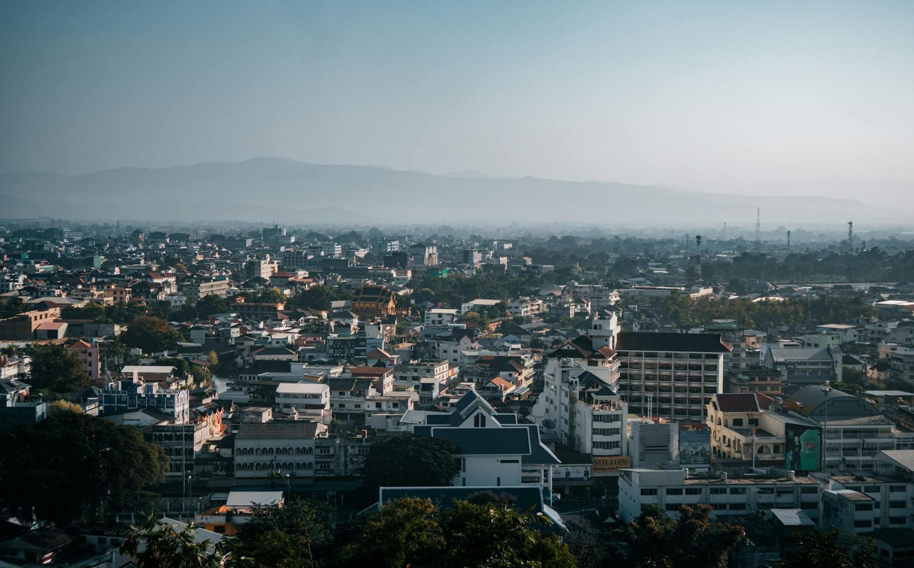 Aerial view of Mueang Chiang Rai city, showcasing its urban landscape and architecture.