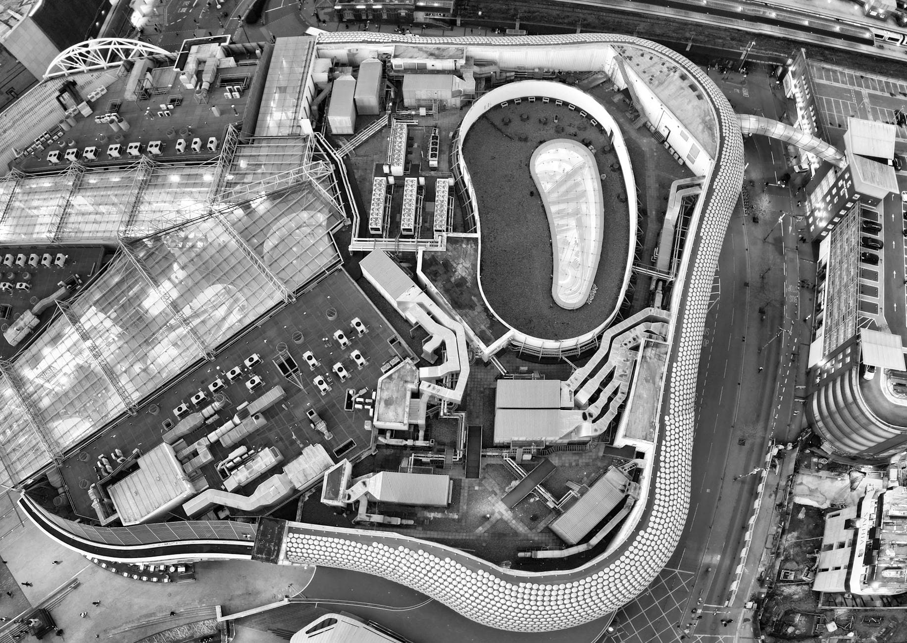 Black and white aerial view of Birmingham's cityscape showcasing modern architecture and urban design.