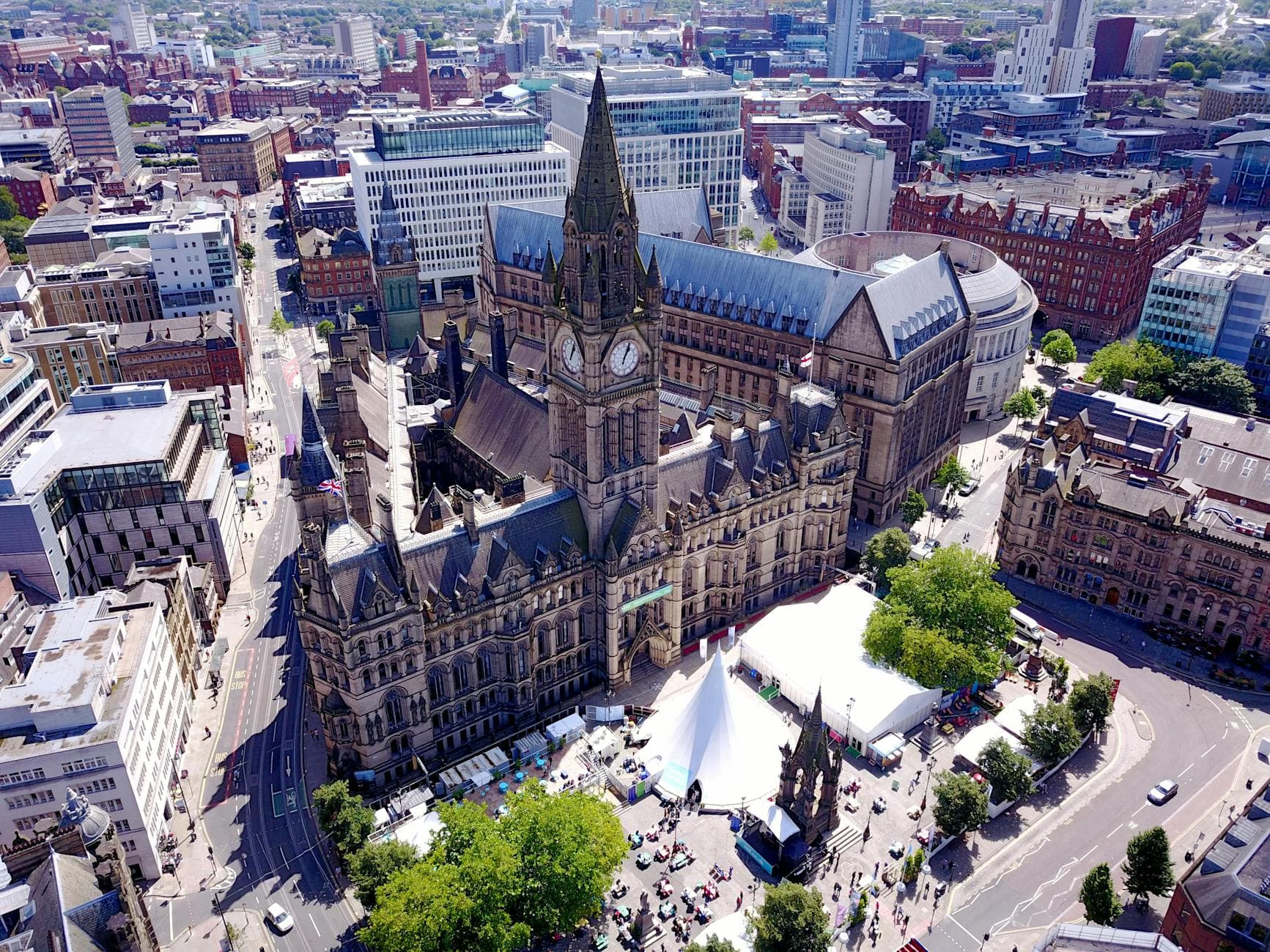 Aerial view of the iconic Manchester Town Hall and surrounding cityscape in the United Kingdom.