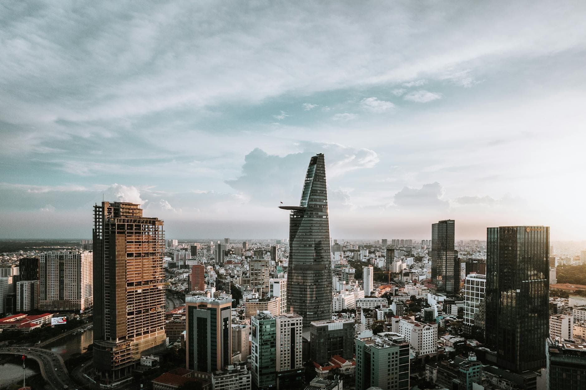 Aerial view of Ho Chi Minh City skyline featuring the iconic Bitexco Financial Tower.