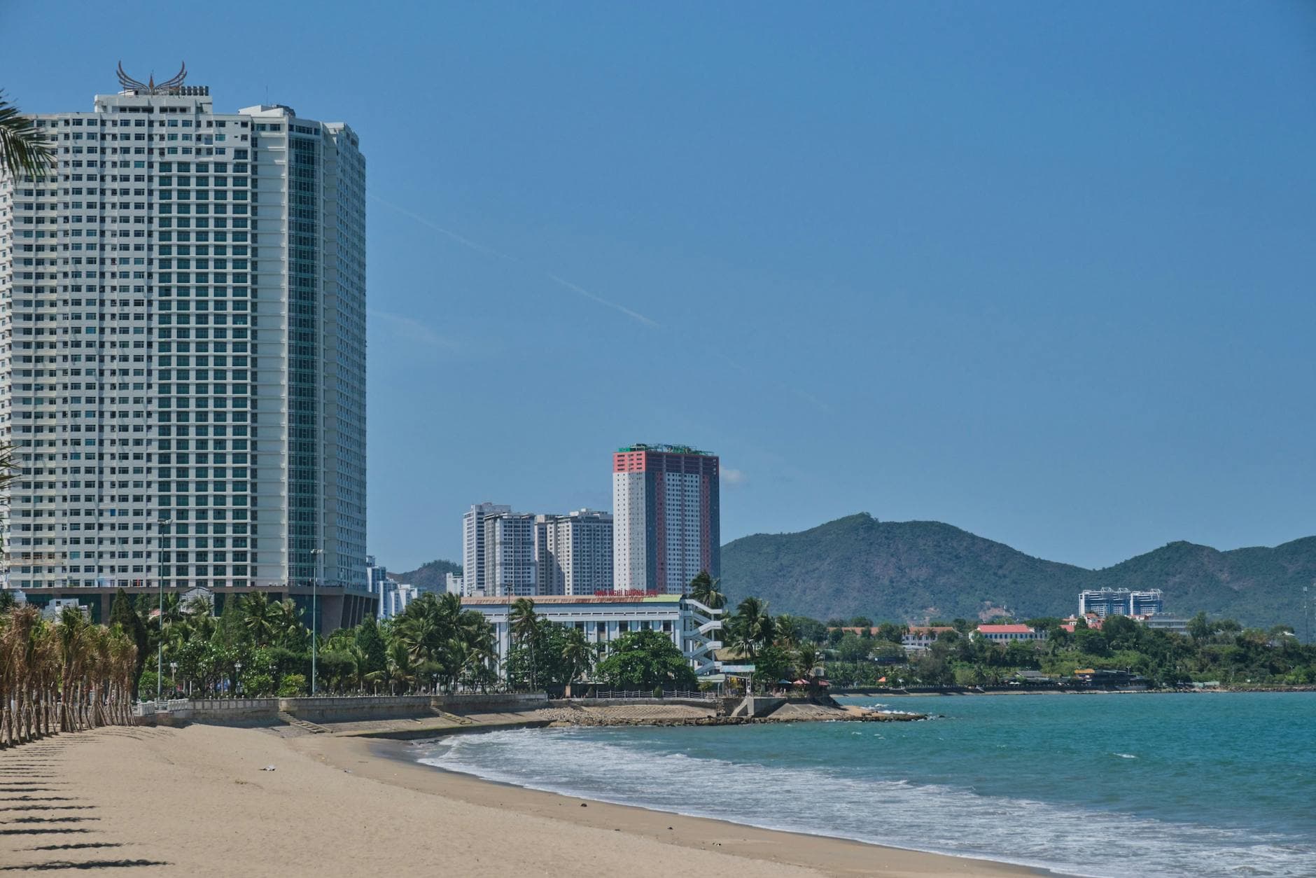Discover Nha Trang's beachfront with luxury hotels and the serene sea.